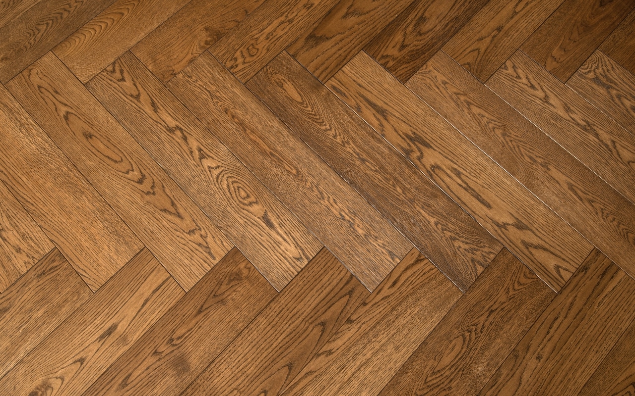 rigid core luxury vinyl plank flooring installed in herringbone pattern showing durable SPC vinyl floor technology